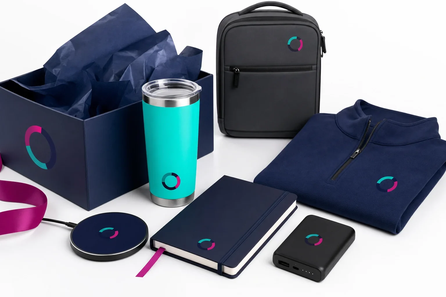 Premium corporate gift set with drinkware, wireless charger, notebook, apparel, backpack, and gift box