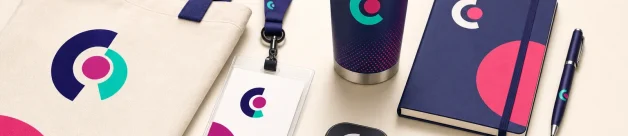 Trade show giveaway products arranged on a modern event table